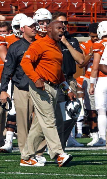 Embattled coach Strong leads Texas in trip to Kansas